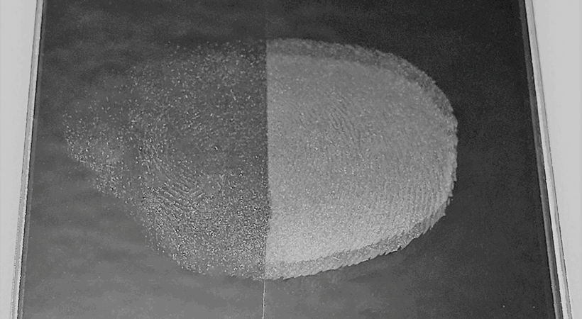 A cross section of glass coated with Nanoprint (left), and uncoated (right)